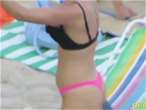 pinkish swimsuit inexperienced bra-less voyeur Beach gals