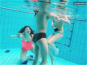 three naked chicks have fun underwater