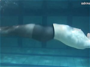 Lozhkova in see through cut-offs in the pool